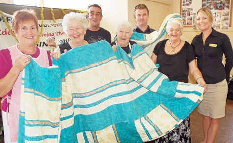 Cover up: Soup Kitchen staff, from left, Sandra, Joan, Narelle, Colleen and Alan accept quilts, blankets and linen from Opal Cove’s Pat Scanlon and Carrie Flanagan. Cover up: Soup Kitchen staff, from left, Sandra, Joan, Narelle, Colleen and Alan accept quilts, blankets and linen from Opal Cove’s Pat Scanlon and Carrie Flanagan.